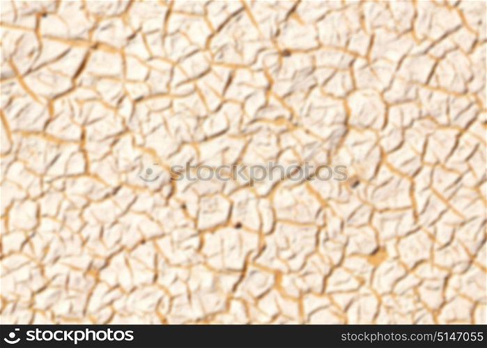 old desert and the abstract cracked sand texture in oman rub al khali blurred