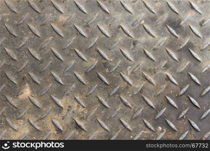 Old diamond plate background and small sand with dirt