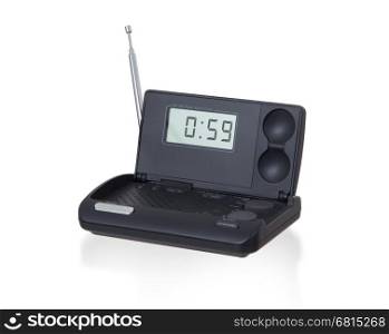 Old digital radio alarm clock isolated on white - Time is 0:59