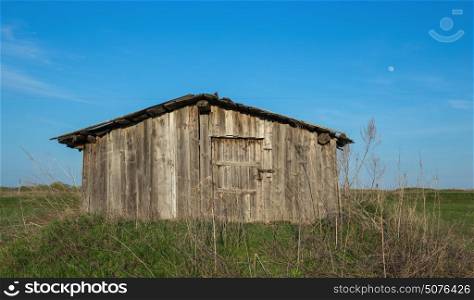 Old dilapidated barn in the field
