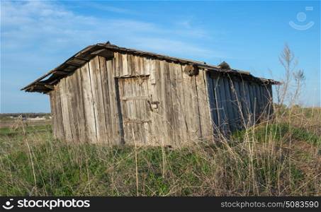 Old dilapidated barn in the field