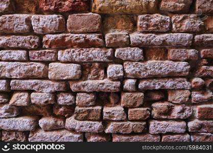 Old dilapidated brick wall close-up