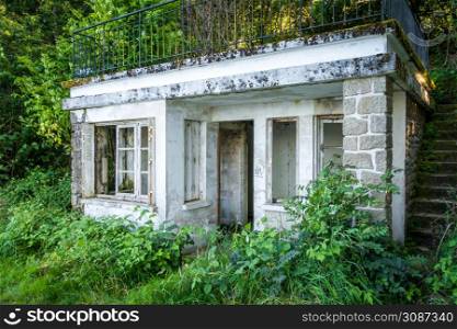 Old dirty abandoned house in a forest. Old abandoned house