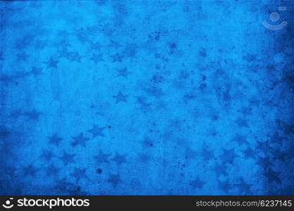 Old dirty blue wallpaper with a stars