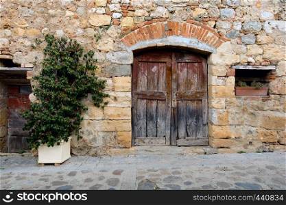 old door ar the streets of ancient small italian town. Tuscany, Italy