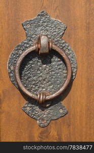 Old doorknocker of an old wood door