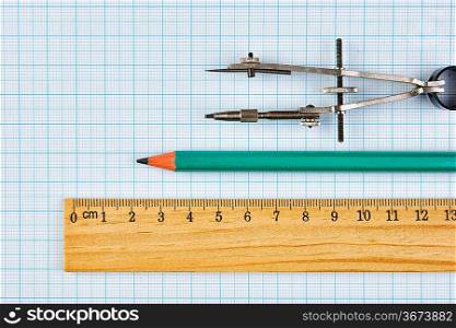 Old drawing tools on graph paper