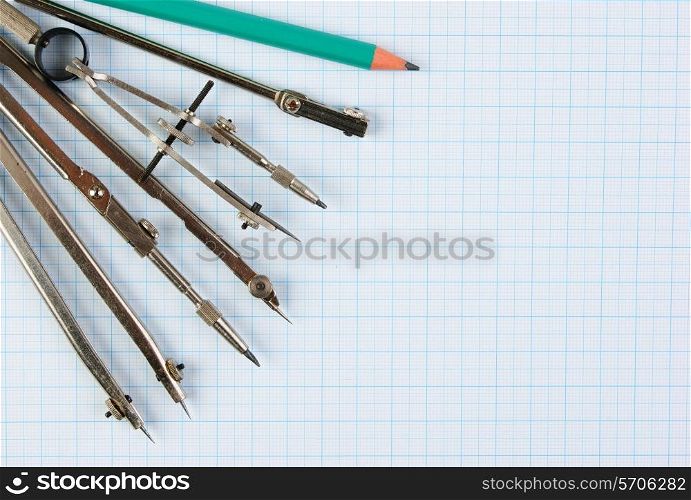 Old drawing tools on graph paper