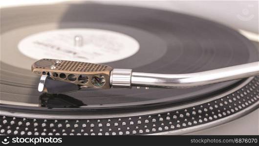 Old dusty vinyl turntable player isolated over white background