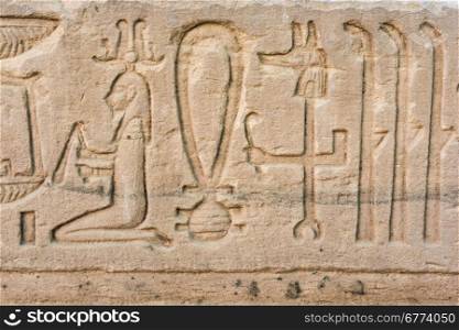 old egypt hieroglyphs carved on the stone. Detail from temple wall in Egypt.