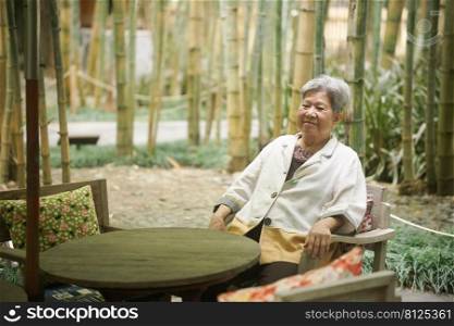 old elderly senior elder woman relaxing on terrace. mature retirement lifestyle