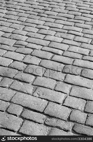 Old English cobblestone road close up.