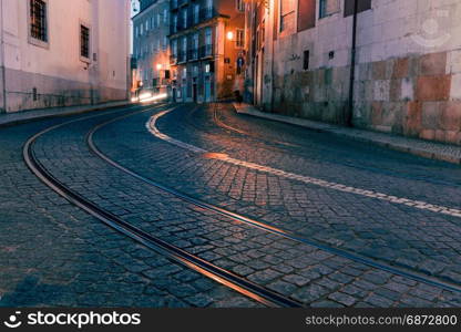 Old European city street at night, Lisbon, Portugal