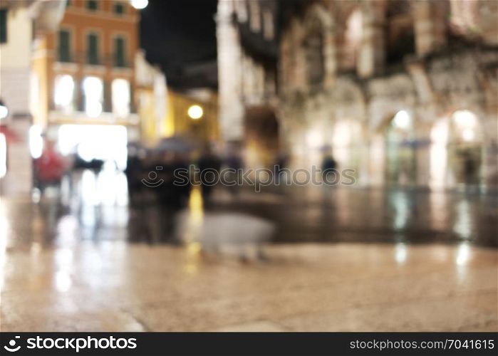 Old European night city blur background. Out of focus city view