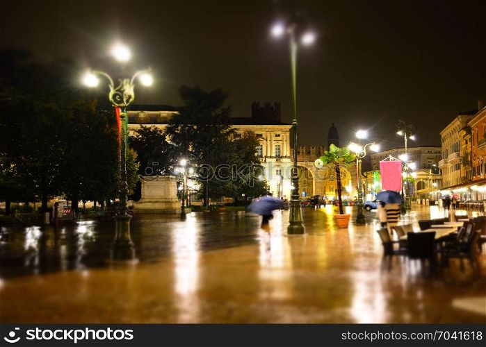 Old European rainy night city tilt shift effect blurry background