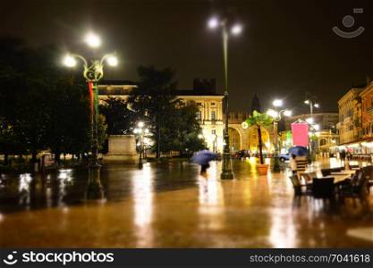 Old European rainy night city tilt shift effect blurry background
