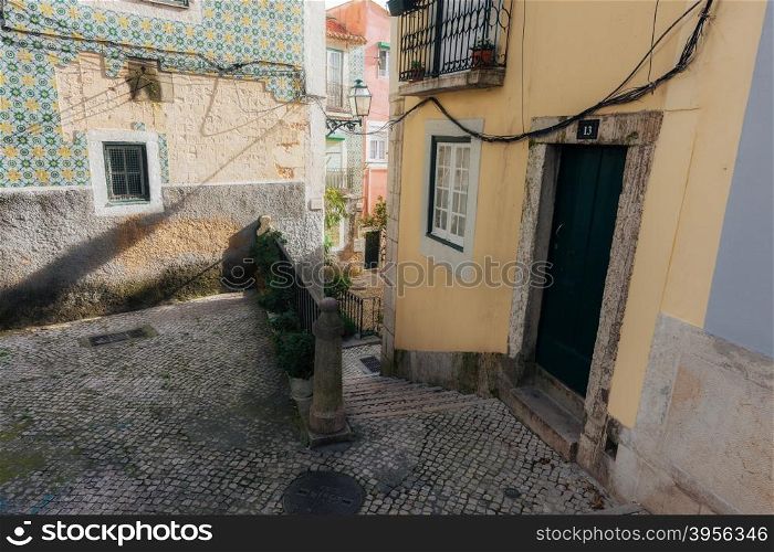 Old european street and colored houses. Lisbon, Portugal