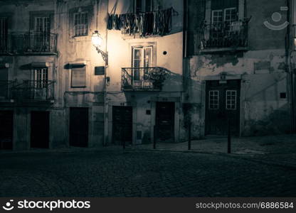 Old european street at night. Lisbon, Portugal