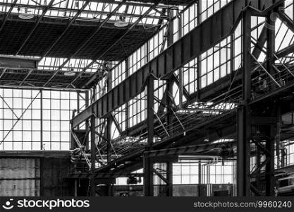 Old factory hall with rusty steel construction