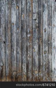 Old faded blue wooden wall, vertical boards as background