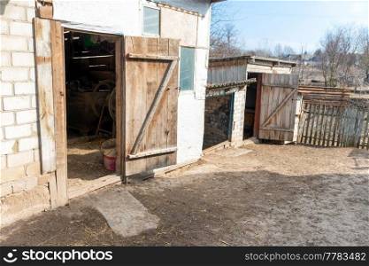 Old farm barn with open wooden door