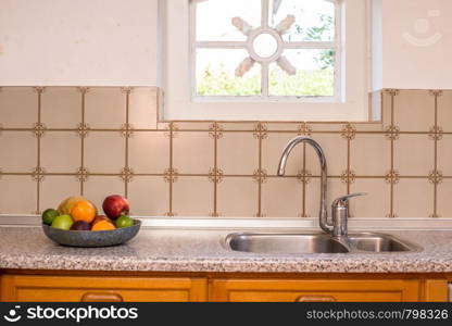 Old Farmhouse Kitchen Sink and Faucet vintage design with pattern tiles and cozy window and colorful fruit. Old Farmhouse Kitchen Sink and Faucet vintage design with pattern tiles and cozy window