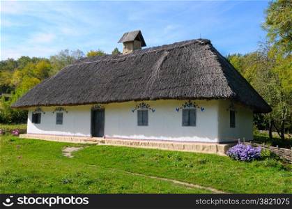 old farmhouse with a thatched roof