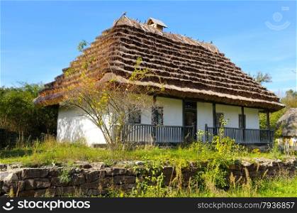 old farmhouse with a thatched roof