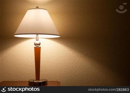 old fashion table lamp over wall background