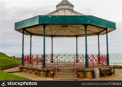 Old fashioned bandstand, sea behind it, landscape