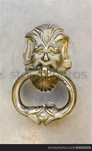 Old fashioned brass door knocker in Grasse, Riviera, France