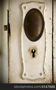 Old fashioned keyhole on a classic timber door.