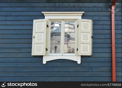 Old fashioned window of wooden house