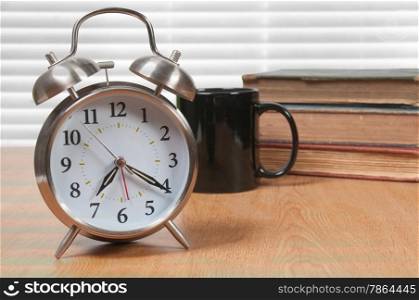 Old fashioned windup alarm clock with bells