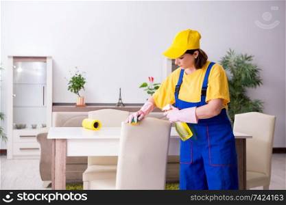 Old female contractor doing housework 