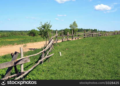 old fence along road