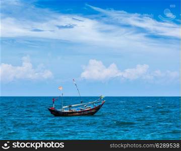 Old fishing boat in sea. Mui Ne, Vietnam