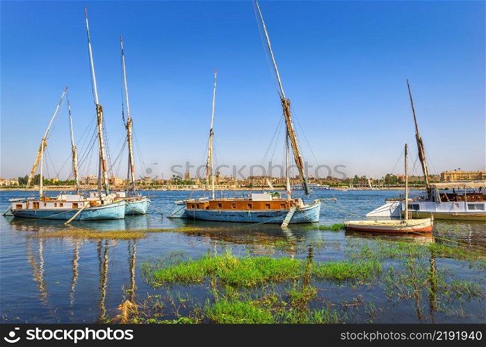 Old fishing boats on river Nile in Luxor, Egypt. Fishing boats in Luxor