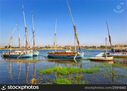 Old fishing boats on river Nile in Luxor, Egypt. Fishing boats in Luxor