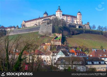 Old fort Marienburg over the city on a sunny morning. Wurzburg Bavaria Germany.. Wurzburg. View of Fort Marienburg on a hill.