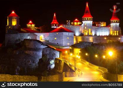 Old fortress with red towers shot at night. Old fortress with red towers