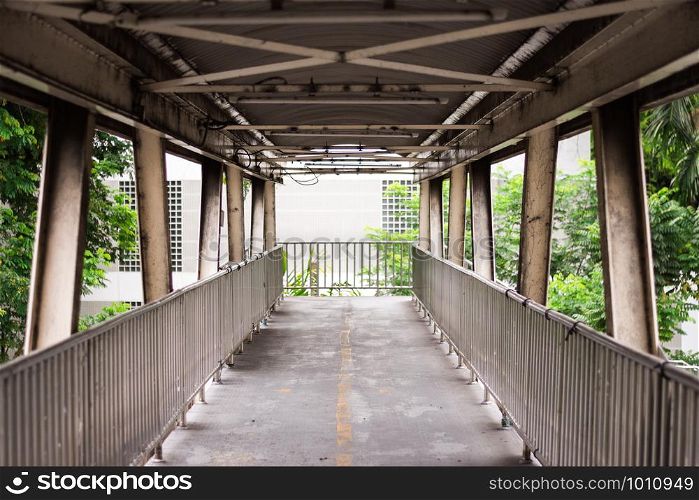 Old grunge footbridge over Phaya Thai Road, Bangkok, Thailand