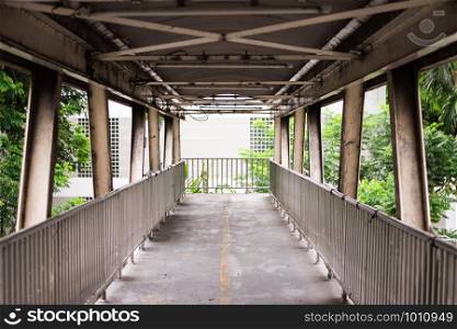 Old grunge footbridge over Phaya Thai Road, Bangkok, Thailand