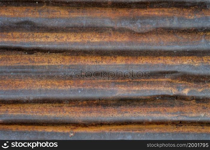 old, grunge, rusty, corrugated metal texture background - wall of weathered shack