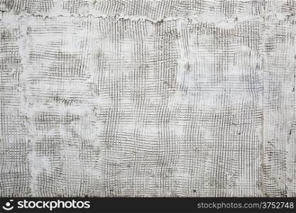 old, grunge stucco texture background on an exterior building wall