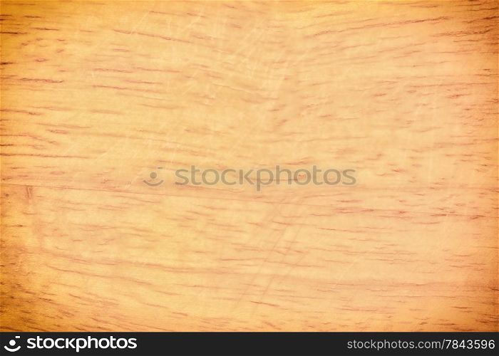 Old grunge wooden kitchen desk background texture. Full frame detail of a worn butcher block cutting board