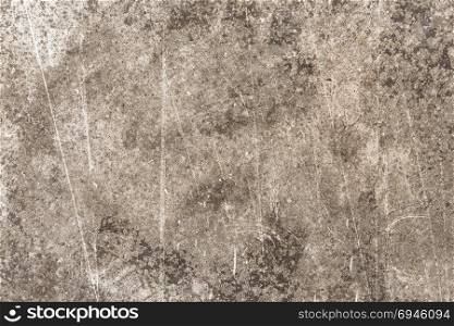 Old grungy scratched stone wall as abstract background texture