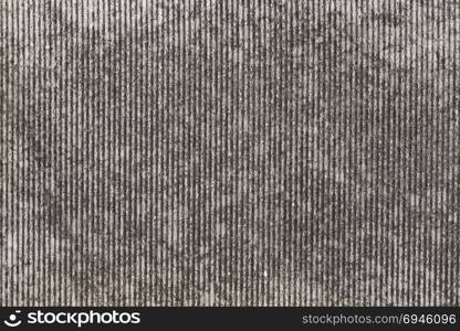 Old grungy scratched stone wall as abstract background texture
