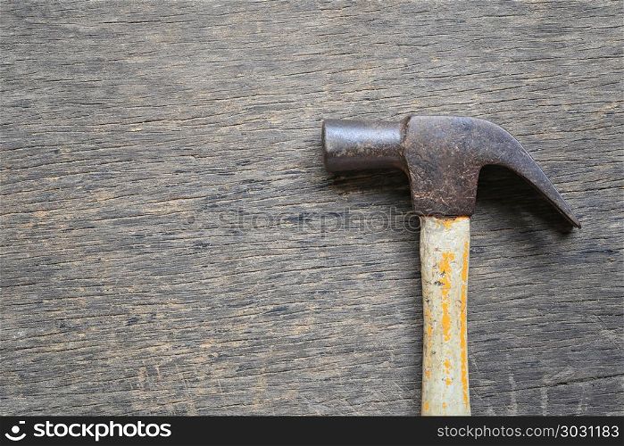 Old Hammer placed on a wooden floor.. Old Hammer placed on a wooden floor and have copy space for design in your work.