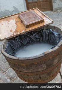 Old Handcraft Papermaking Process With Water, Bucket and Wooden Sieve.. Old Handcraft Papermaking Process With Water, Bucket and Wooden Sieve